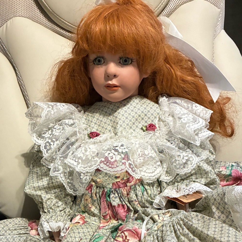 Elegant Porcelain Doll with Red Hair and lace dress